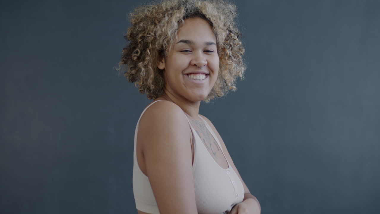 Portrait of a smiling woman with curly hair
