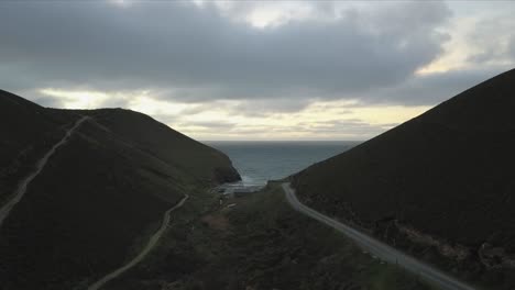 a small tiny beach and waves are revealed in cornwall