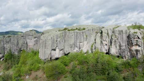 drone approaching the rock face of belintash plateau situated in rhodope mountains in the province of plovdiv in bulgaria