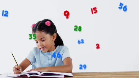 Multiple-numbers-and-symbols-floating-against-school-girl-writing-against-white-background