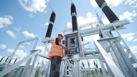 electrical engineers inspect the electrical systems at the equipment control cabinet