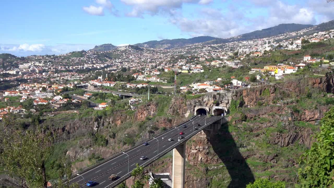 overview to the city of Funchal Madeira with the highway and the whole city on the mountainside