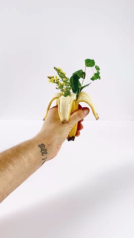 banana floral arrangement in hand