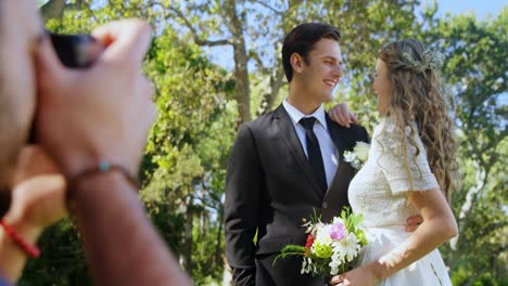 Photographer-taking-photo-of-groom-and-bride-4K-4k