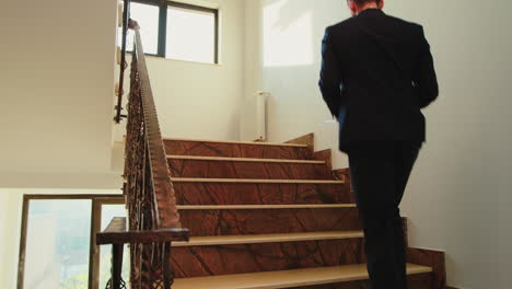 coworkers moving on office stairs