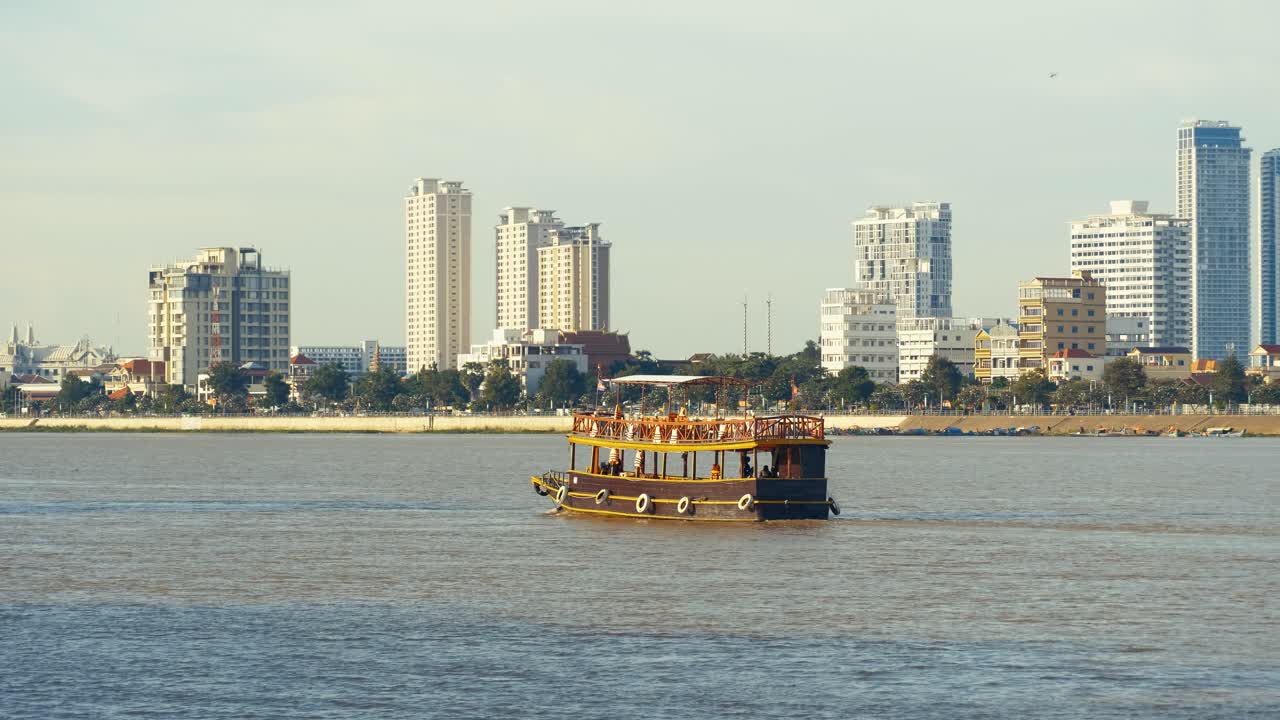 Boat on the River with City Skyline in the Background
