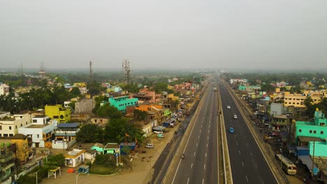 high-altitude aerial shot of indian industries, with smoky emissions visible from numerous stacks.