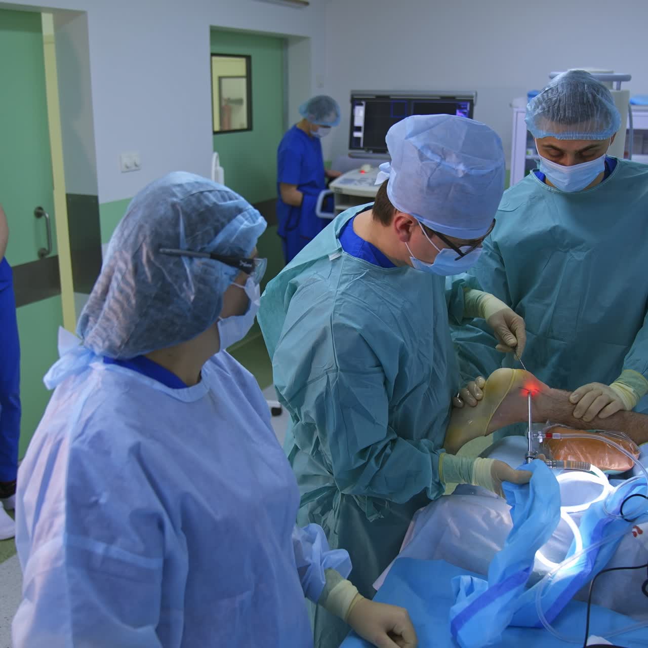 Group of surgeons in operating room with surgery equipment. Process of trauma surgery operation