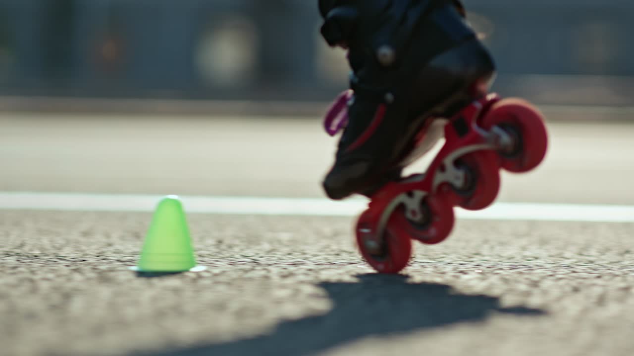 Close-up of the roller's legs circling the cones. Roller skating is a professional element in roller skating. 4k, 10bit, ProRes