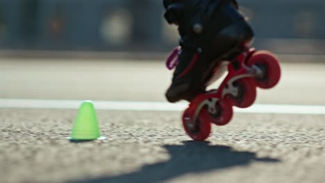 close-up of the roller's legs circling the cones. roller skating is a professional element in roller skating. 4k, 10bit, prores