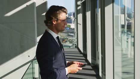 businessman using smartphone in a modern office building