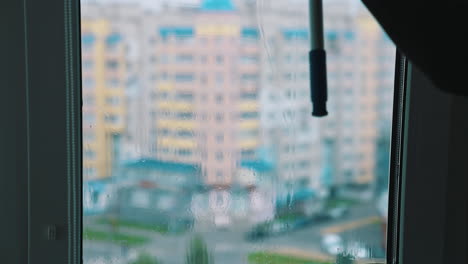 cleaning window with squeegee. window cleaner with squeegee cleaning glass window