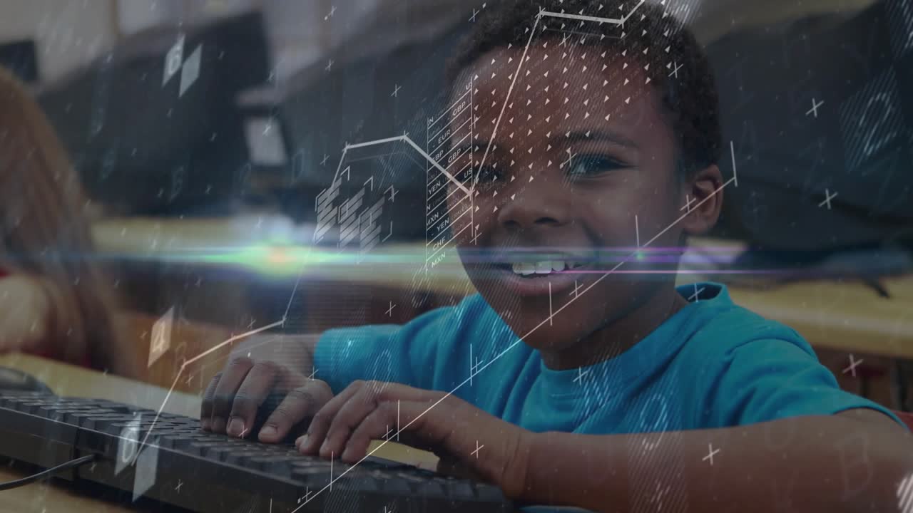 Boy tapping keyboard and animating data overlays on screen in school lab showing learning progress