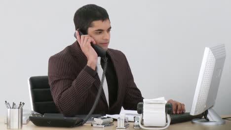 Businessman-working-on-his-desk