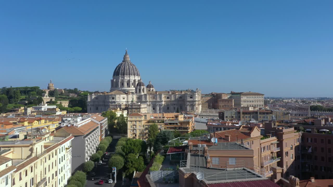 Amazing aerial drone descending over the Vatican, showcasing the dome of St. Peter’s Basilica and the iconic square from Roman neighborhood, Italy