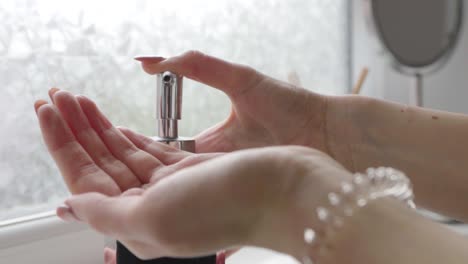 Lady-washing-hands---using-hand-wash-dispenser-|-Close-up-shot