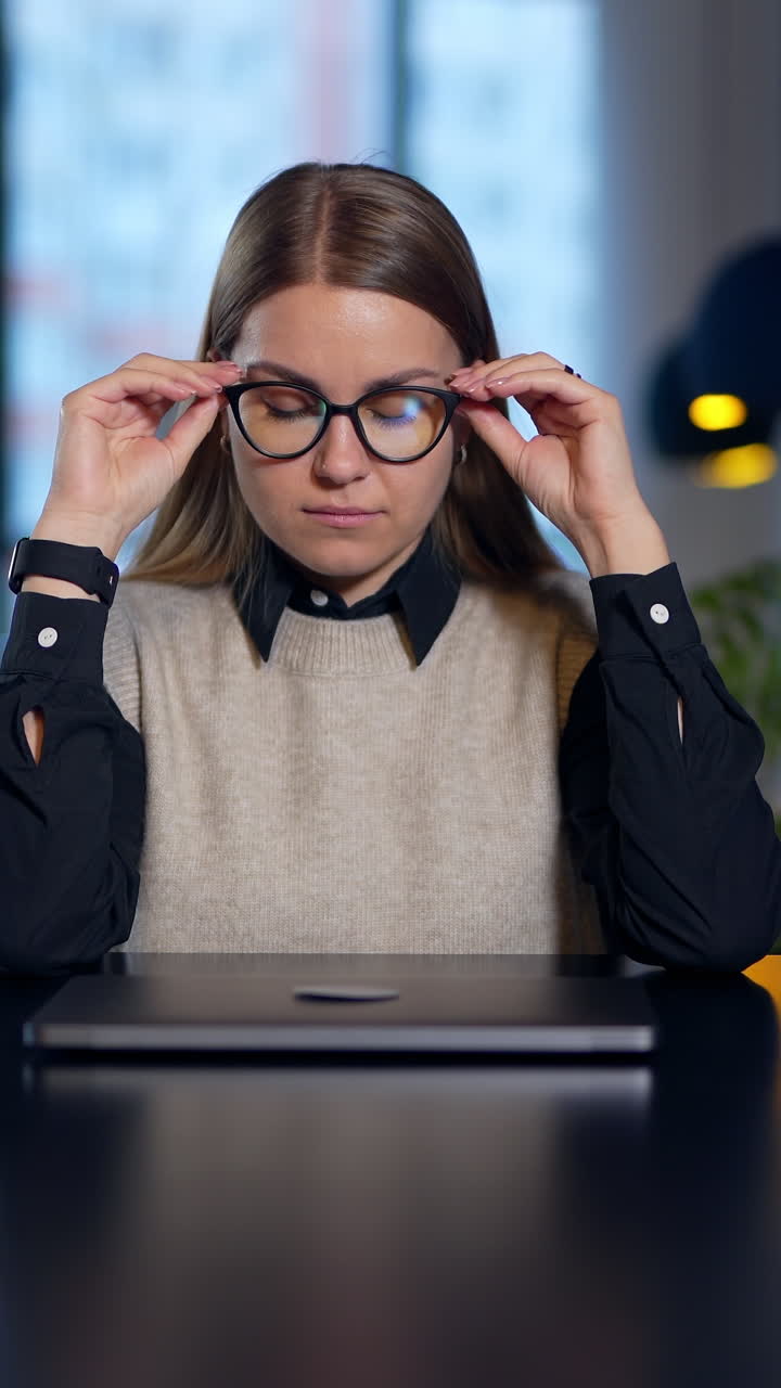 Handsome office manager working with laptop. Successful young businessman working with computer in office. Vertical video