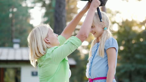 mom puts on a protective helmet for her daughter concept - care and safety hd video