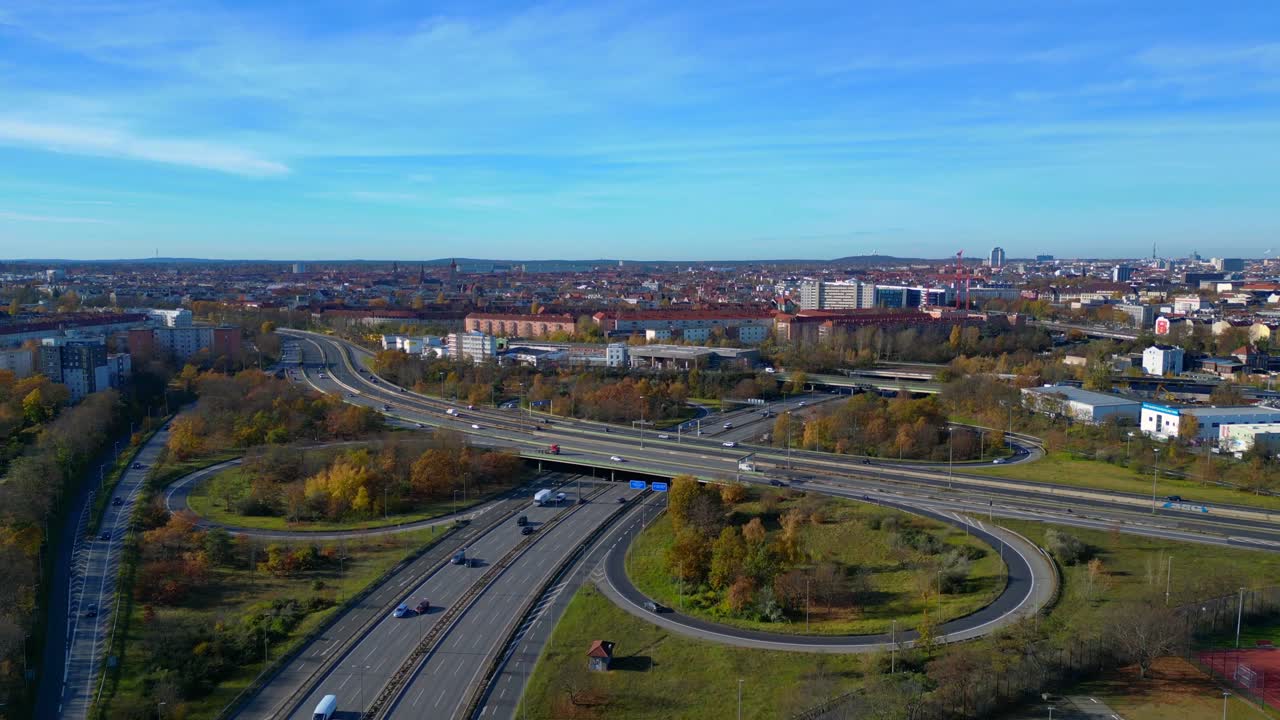 Aerial view tracking over the vast urban landscape of Berlin under a clear sky. Magic aerial view flight ascending raise up drone