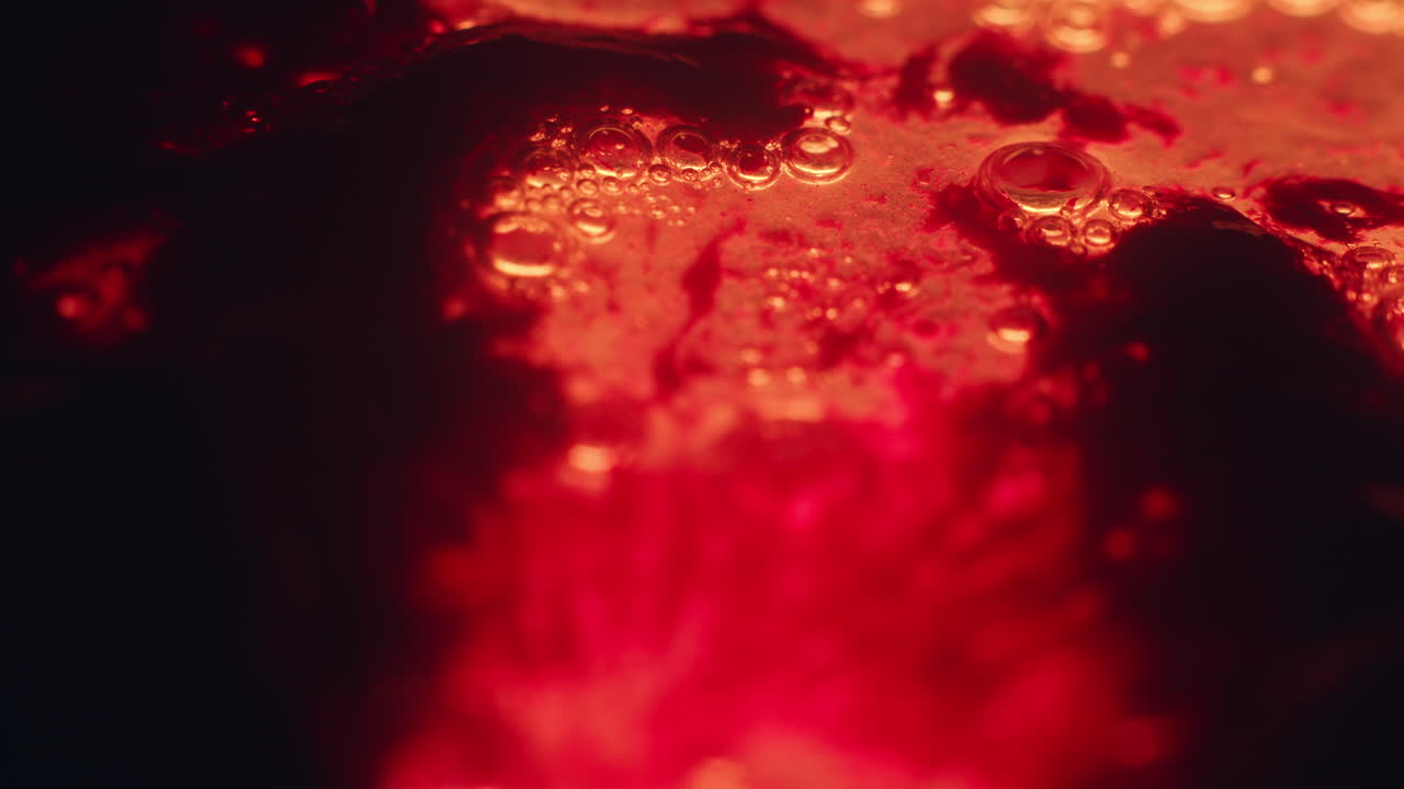 Colourful, organic, liquids macro shots buzzing and flowing