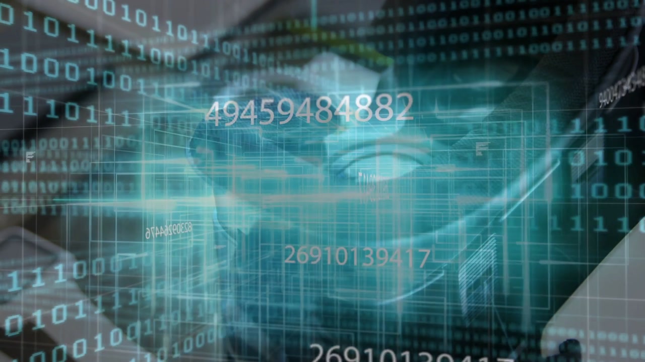 Translucent teal skull hologram rotating and pulsing over tablet on desk, with scrolling binary