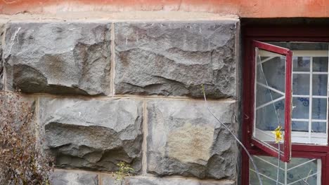 open window on a stone wall