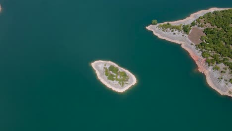 aerial drone shot zoom in top view island in slansko lake, montenegro