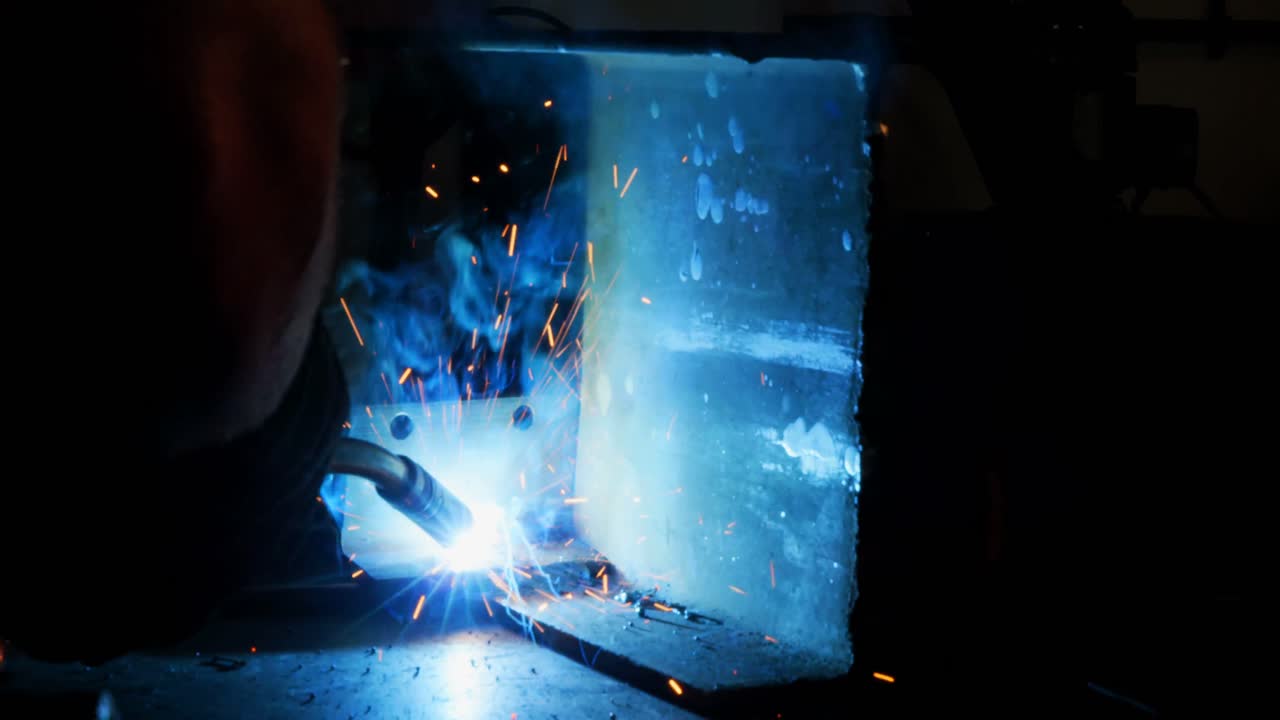 Welder welding a metal