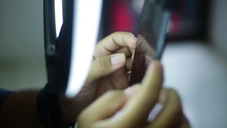 food blogger using smartphone taking beautiful photo of dish to share on social media