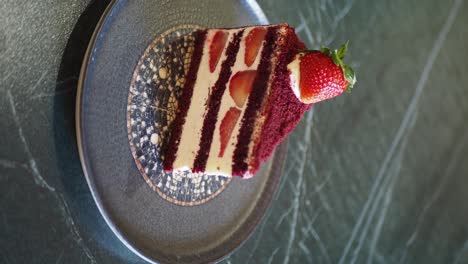 red velvet cake slice with strawberries