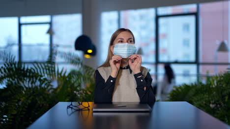 woman wearing mask in office setting