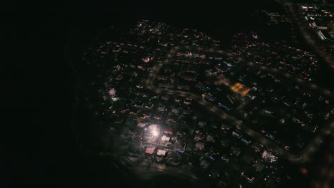 Looking-down-view-at-city-lighting-up-by-fireworks