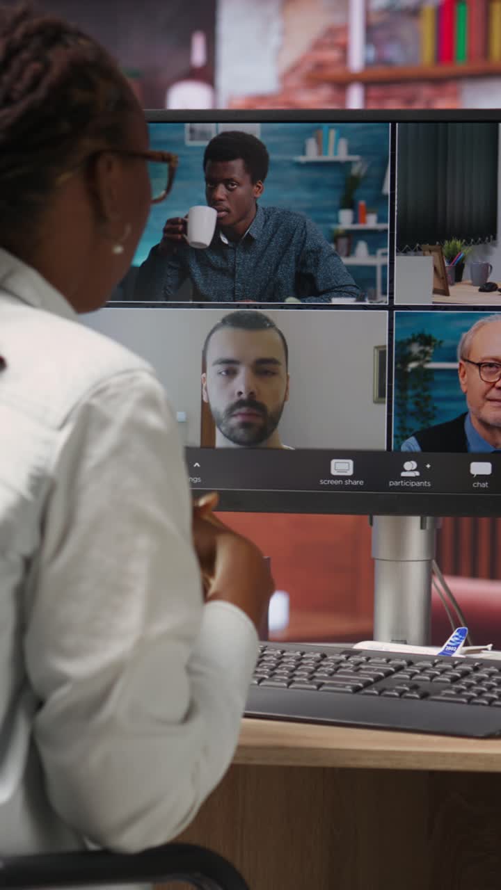 Vertical video Remote worker in home office saluting coworkers during internet videocall