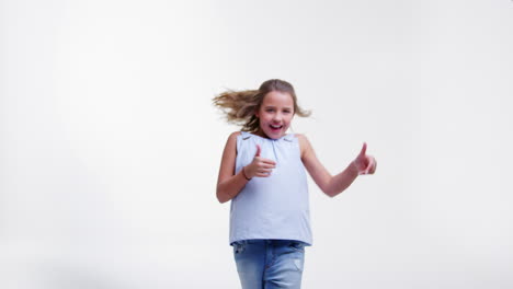 Girl-Jumping-And-Posing-Against-White-Studio-Background