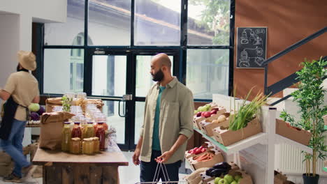 middle eastern client looks at produce
