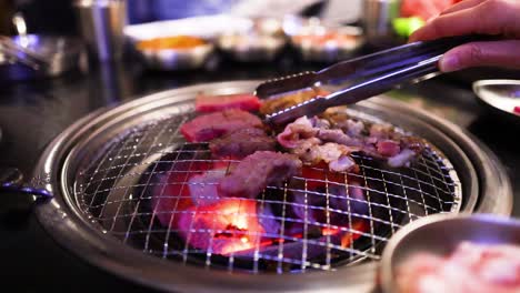 grilling meat on a korean bbq grill