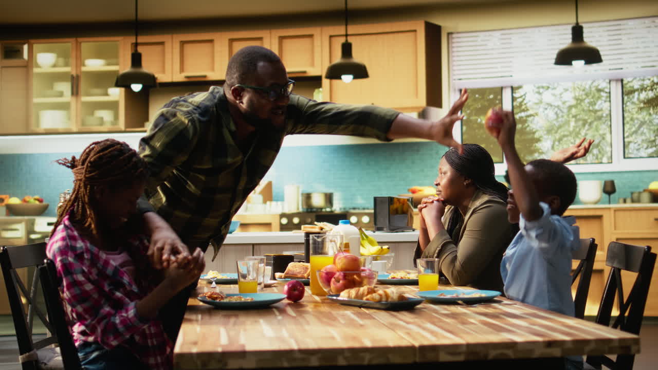 Family Arguing at Breakfast Table in Kitchen