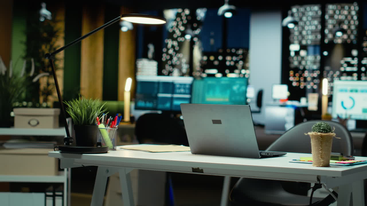 Vertical Video Modern empty office glows with performance metrics and forecasting graphs