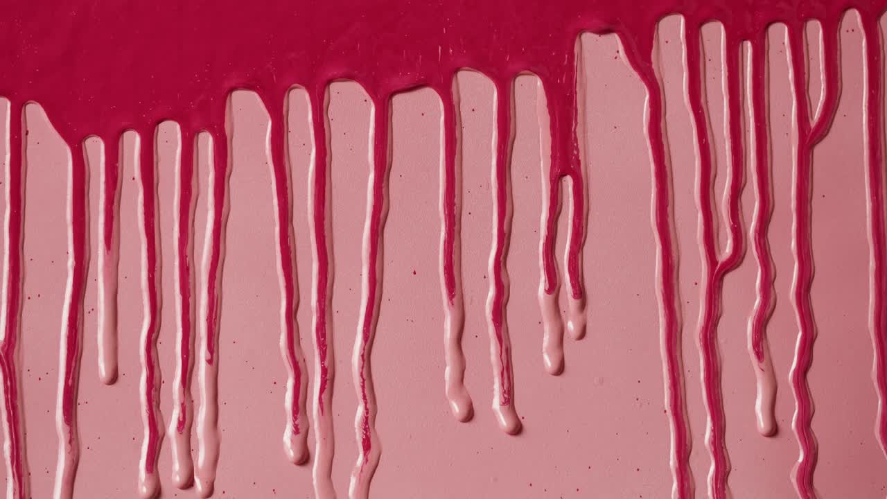 Vibrant Pink Liquid Paint Dripping Down a Smooth Surface