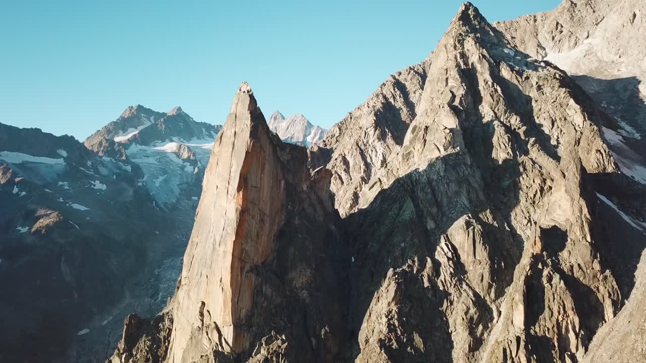View of the sharp mountains during a sunrise near the hut of orny in switzerland in valais
