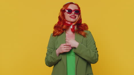 Cheerful-lovely-redheaded-young-woman-fashion-model-in-jacket-smiling-and-looking-at-camera-alone