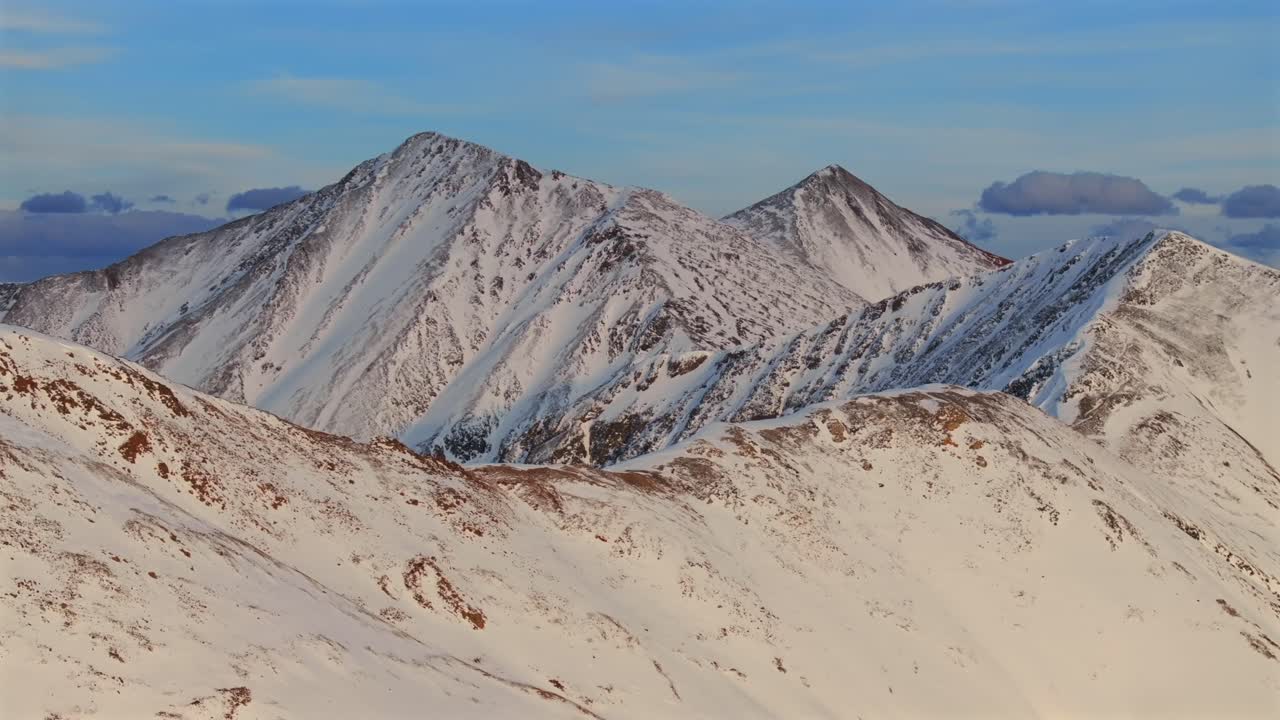 Loveland Pass winter spring golden hour sunset 14er Grays and Torreys Peak Colorado aerial drone panorama landscape Arapahoe Basin backcountry deep powder snow Rocky Mountains backwards