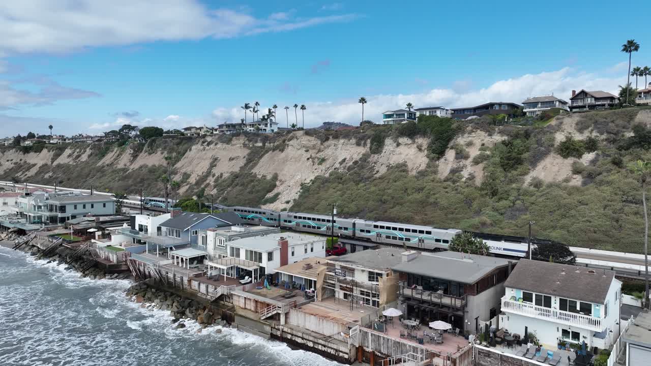 Commuter Train Passes by Beachfront Homes