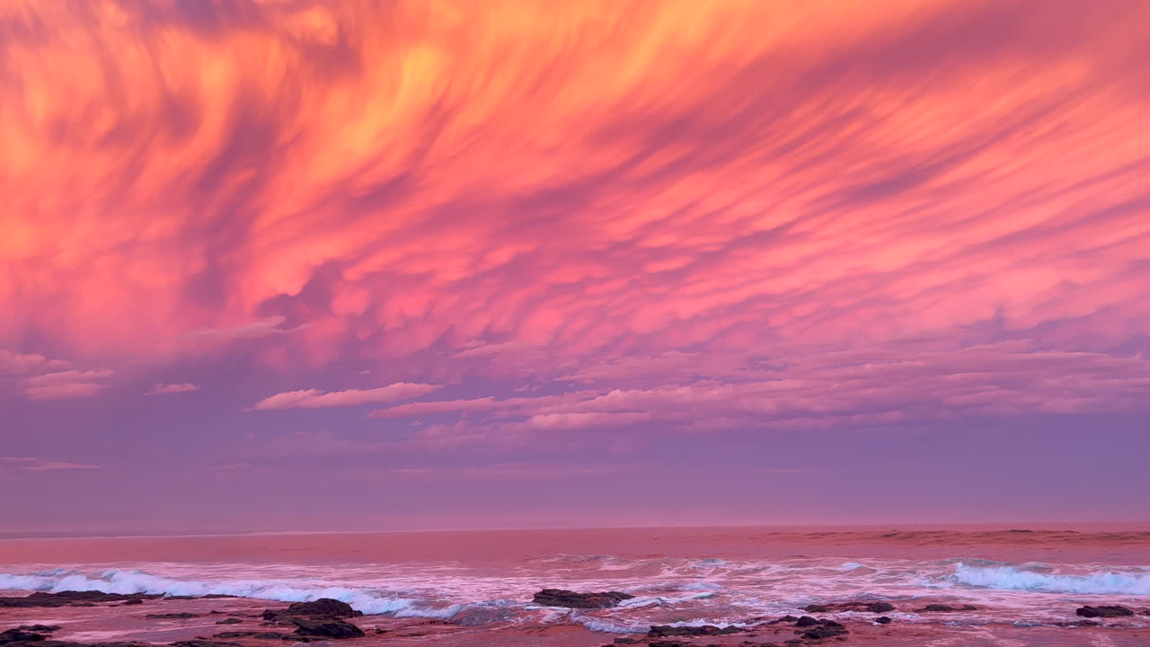 JBay Jefferey's Bay South Africa most stunning best ever incredible summer sunset thunderstorm clouds golden orange red pink waves crash on coastline shore Supers Impossible boneyard surf pan left
