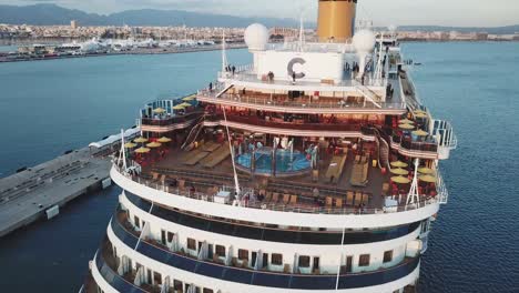 cruise ship deck with pool and passengers