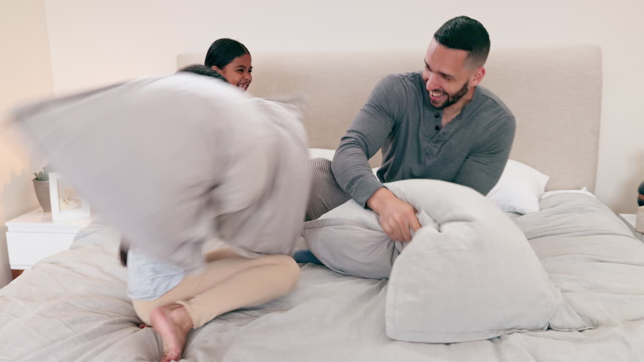 Father, bed or pillow fight with children for love