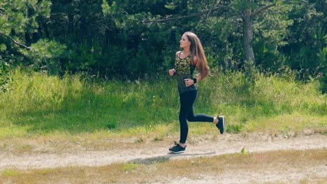 slow motion side shot young girl goes in for sports in morning 1