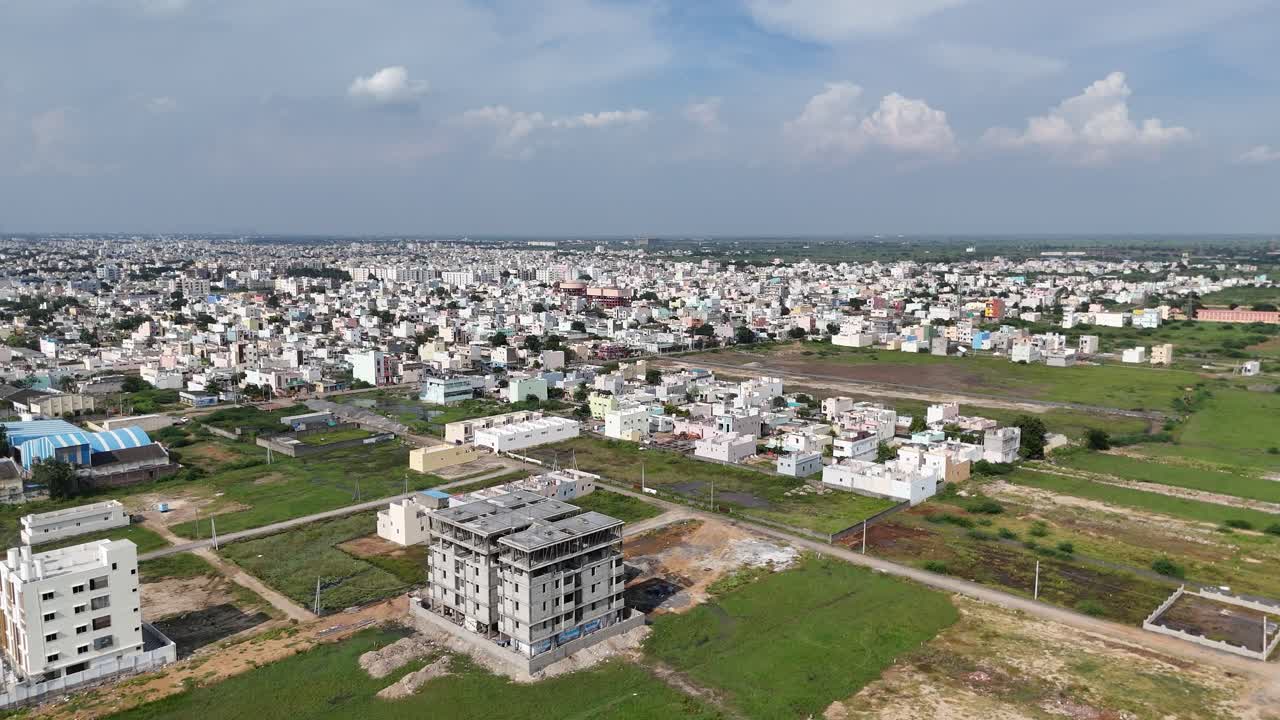 Aerial shot of a scenic highway surrounded by greenery in Amaravathi, Vijayawada.