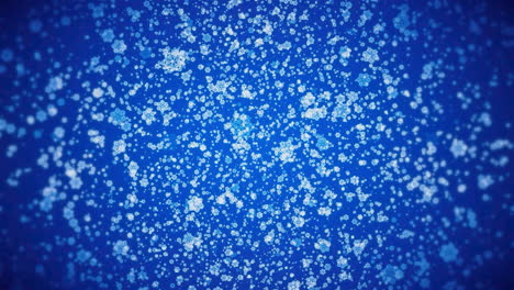 copos de nieve cayendo sobre un fondo azul