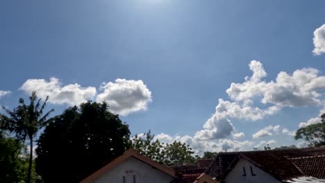 time lapse of the movement of white clouds in a blue sky, weather changing from sunny to slightly cloudy